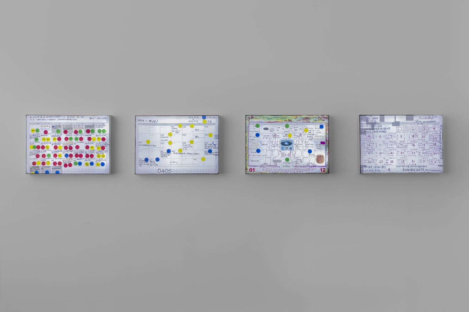 In Other Moonlights, installation view: the monthly calendars shown as lightboxes